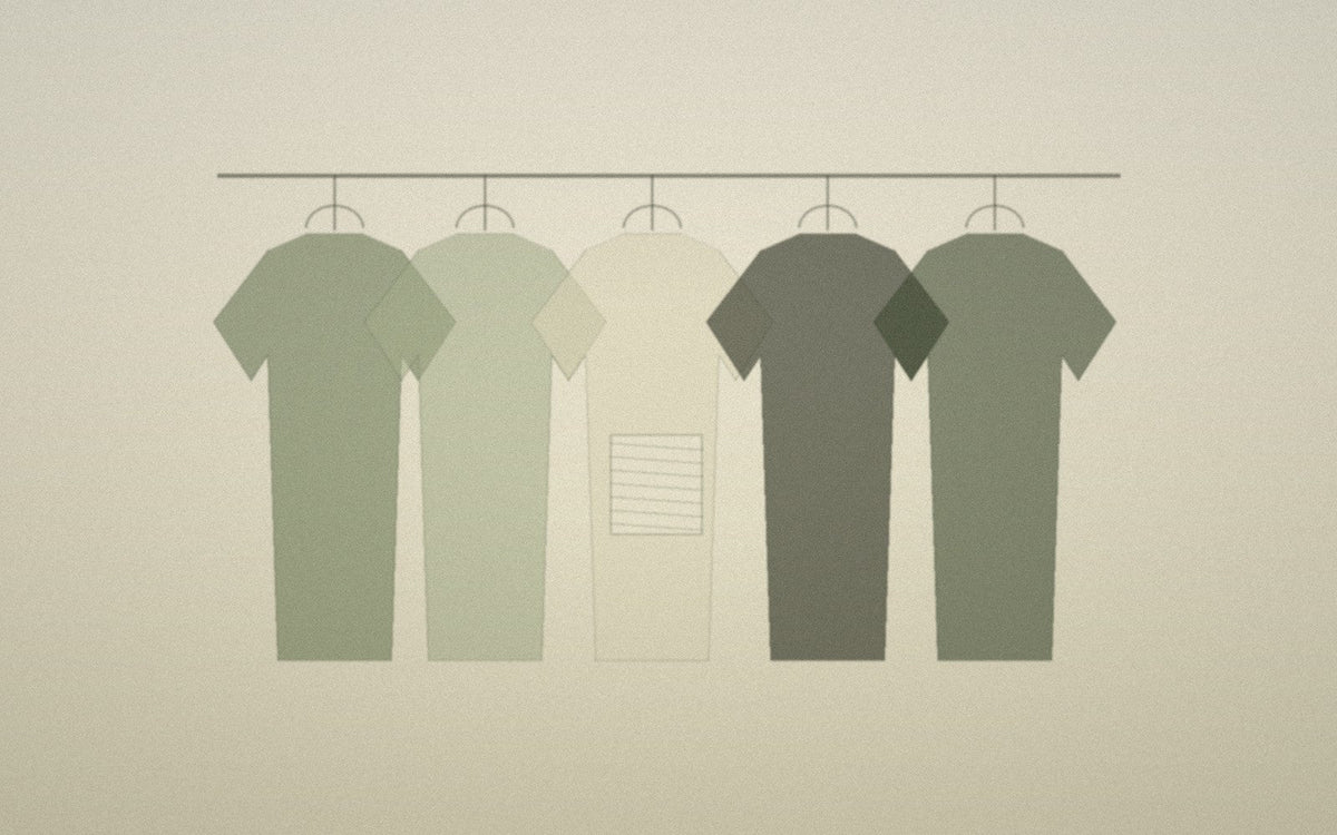 Small quiet wardrobe with a visible mending patch suggesting continued wear